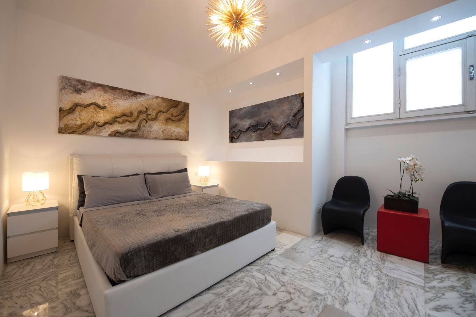 Quiet bedroom angle with soft lighting and marble flooring